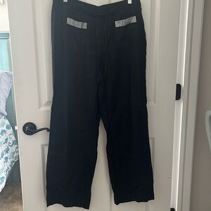 Black linen pull on pants with rhinestones  detail on front pockets.